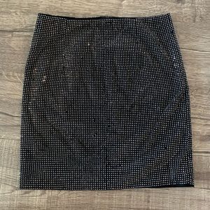 Silver studded black mini skirt